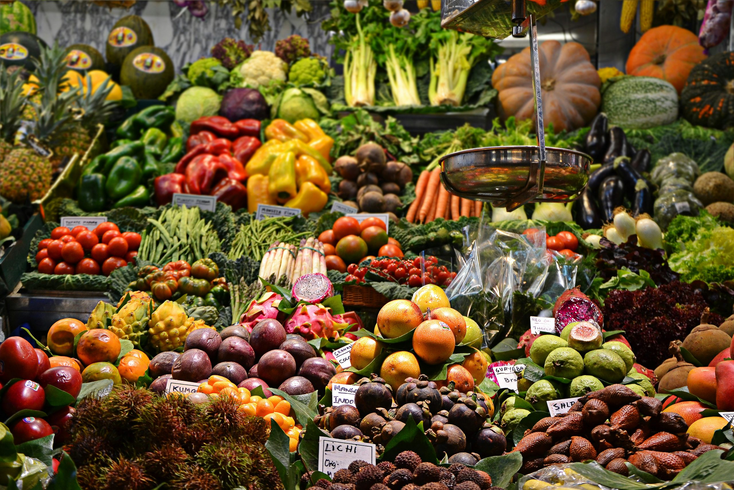 Agricultural market trade in Vijayapura showing fresh grapes and pomegranates at APMC market